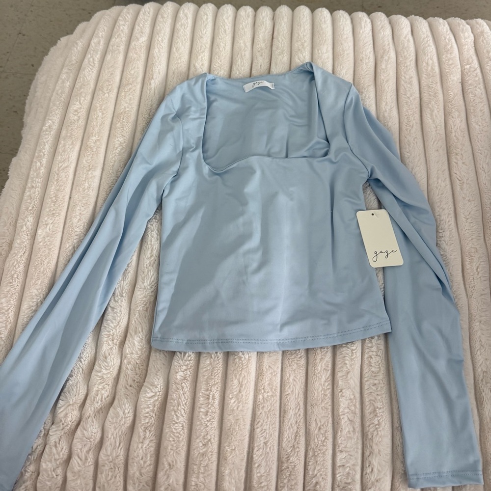 Scooped light blue long sleeve shirt